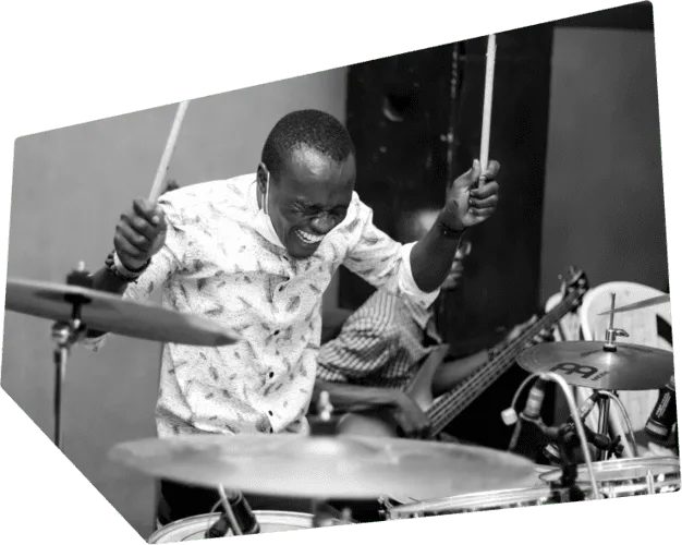 Drummer enjoying a practice session on his drum set.