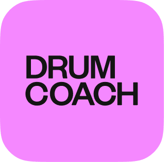 Drum Coach logo in contrasting pink and black, symbolizing the UpBeat brand's dynamic and rebellious identity.